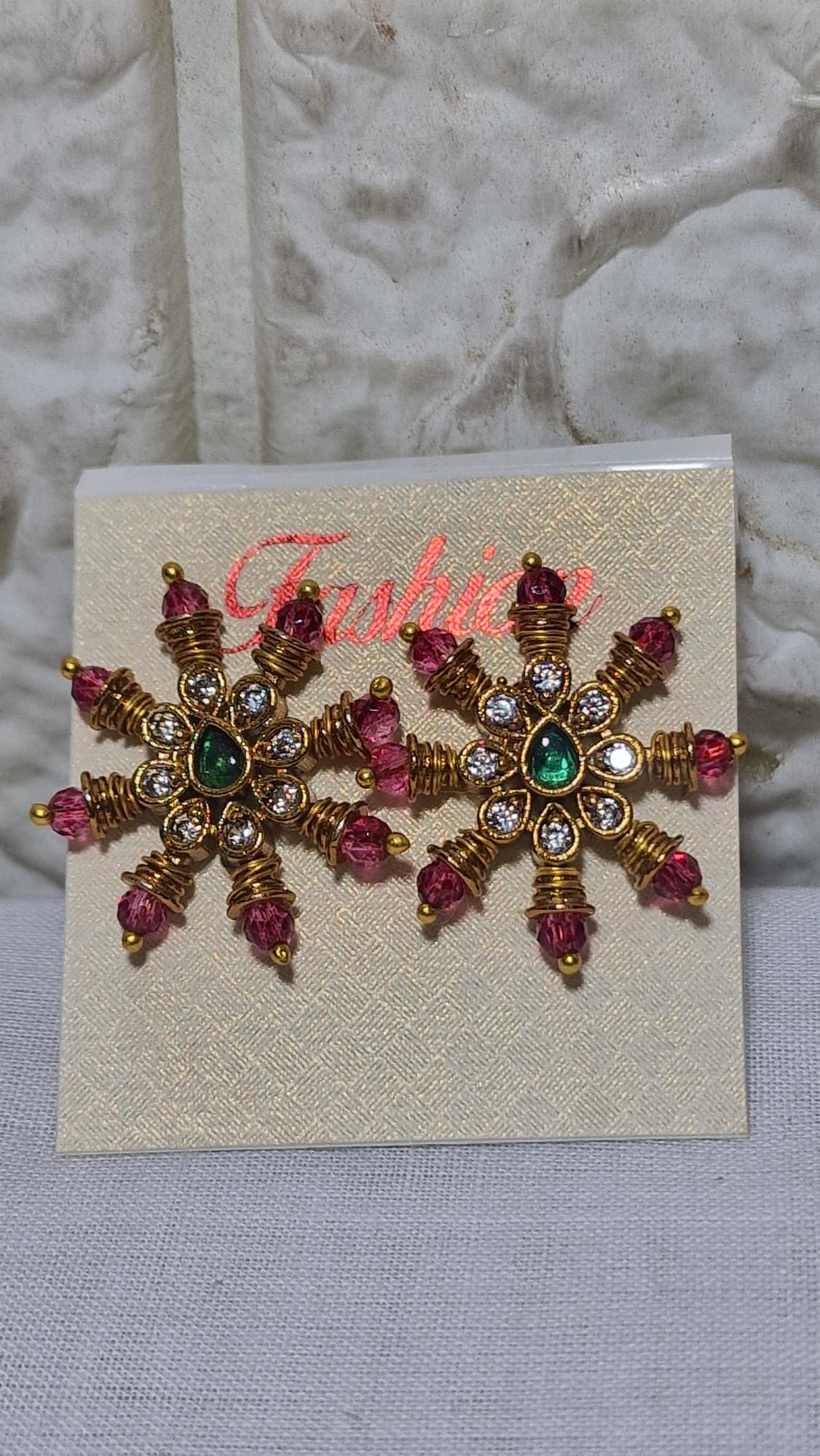 Magenta ray floral earrings